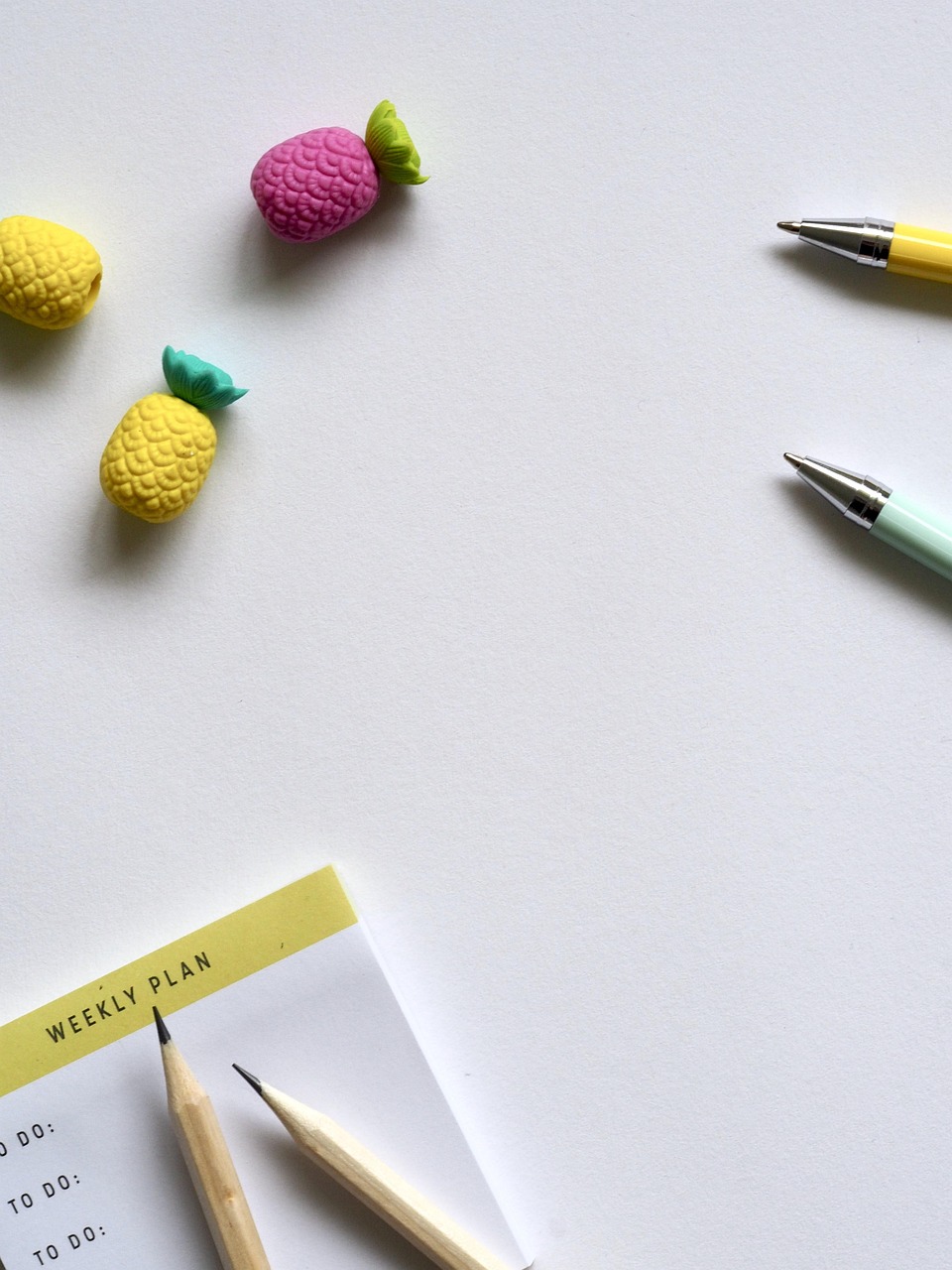Minimal Desk Flatlay with Pineapple Erasers