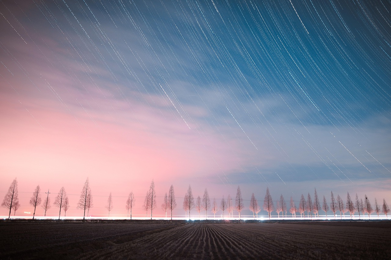 Pastel Star Trails Over Fields